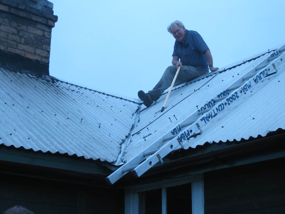 06 Grant on the roof fixing a leak in the valley gutter